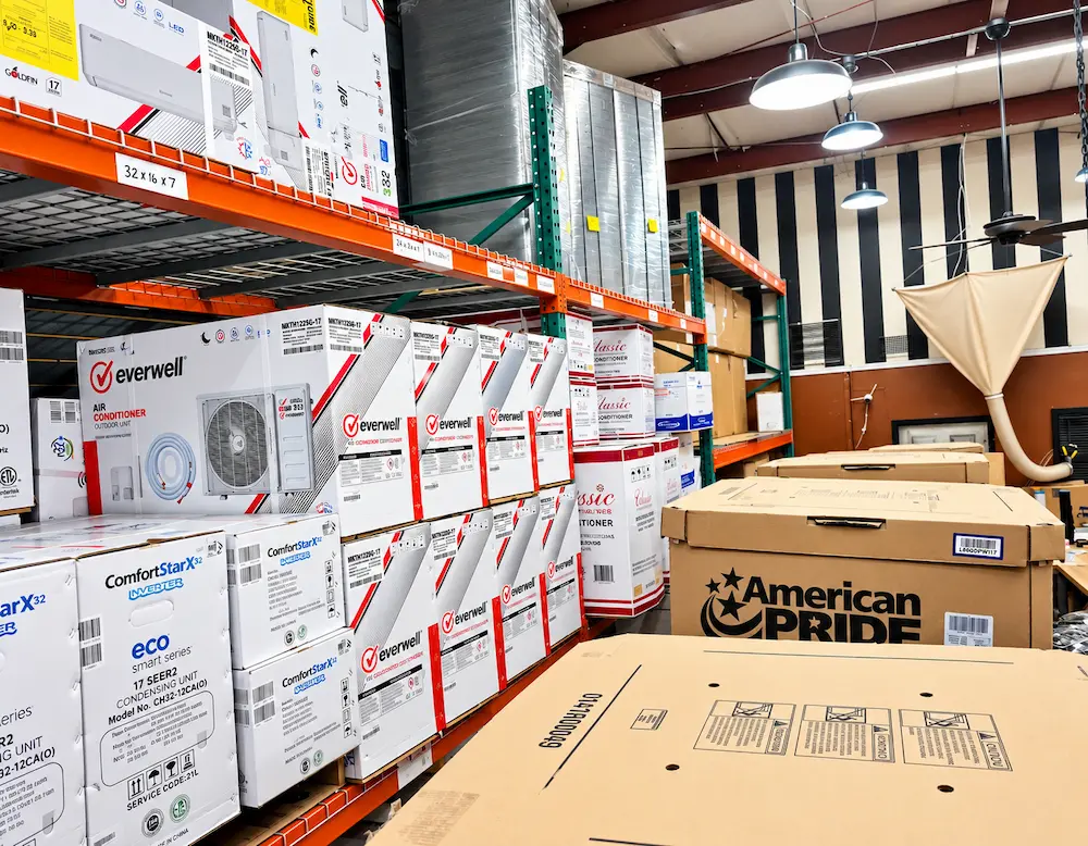 Mini split systems stocked on warehouse racks at AirPrime Distribution